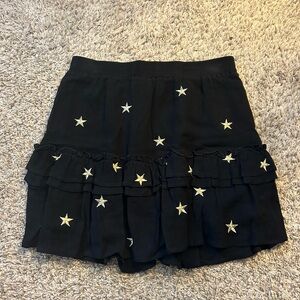 mini black skirt with gold stars! in great condition!